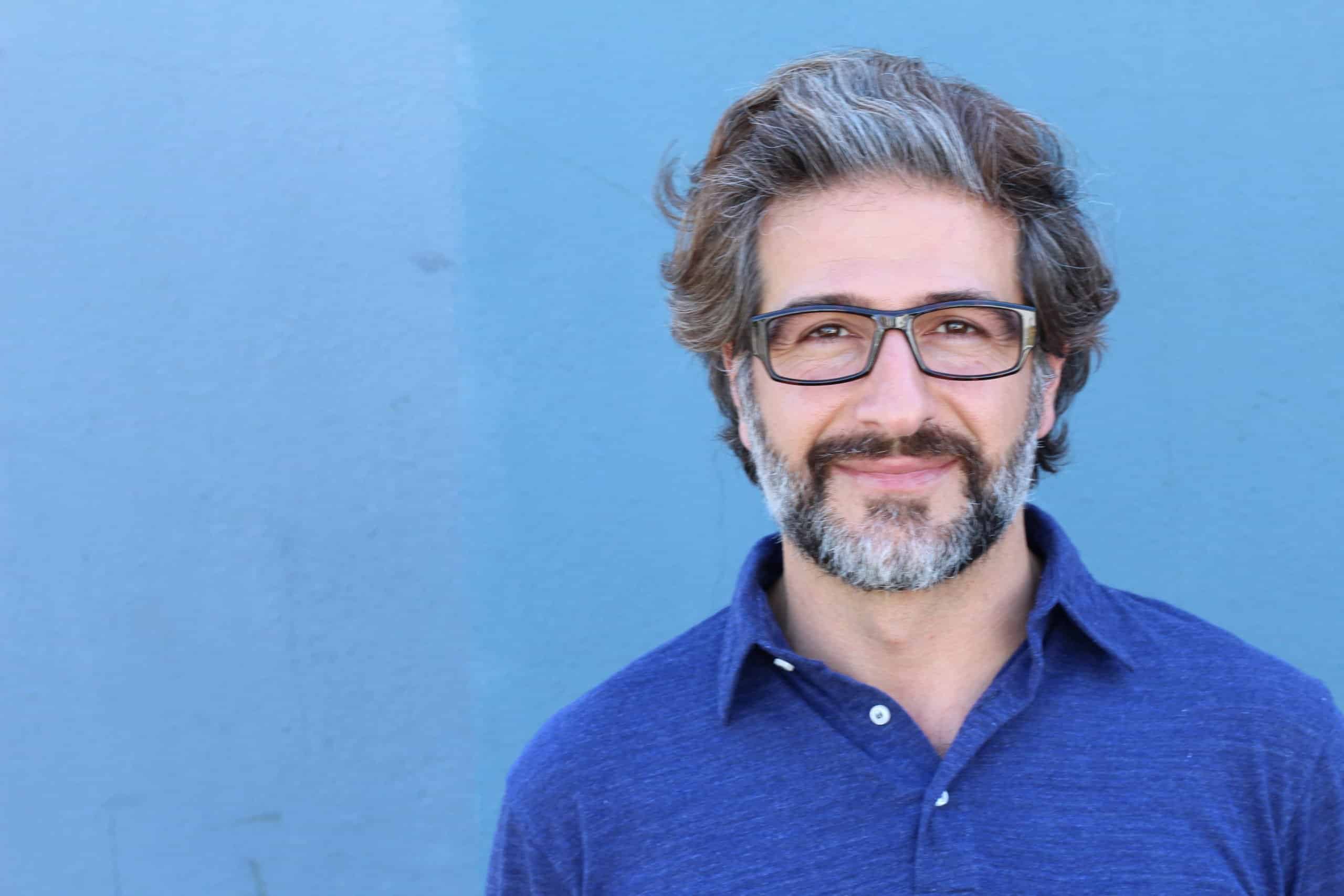 Closeup portrait of happy handsome mature man with glasses